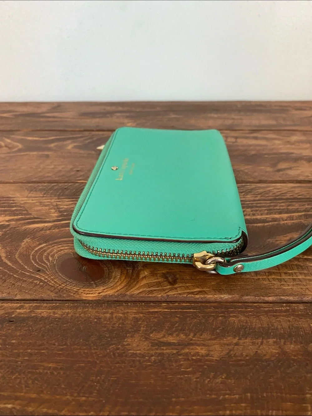 kate spade teal zip-around wristlet with strap